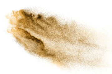 Golden sand explosion isolated on white background. Abstract sand cloud. Gold sand splash against...