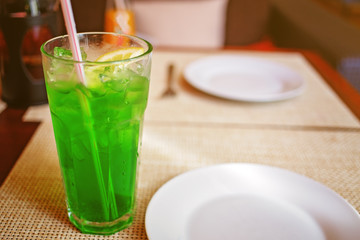 Herbal drink with ice and a slice of lemon