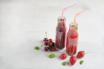 Fruit cocktail or smoothies with fruit on a light background. With empty space for writing