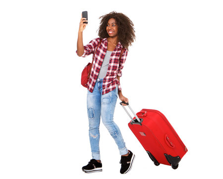 Full Body Attractive Young African American Girl Walking With Suitcase And Taking Selfie