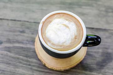 black coffee cup on wood, coffee time concept.
