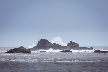 big wave after rocks in water in cloudy morning in Morocco