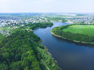 Fototapeta na wymiar aerial view of river. small town on background