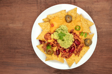 Nachos with cheese, traditional Mexican snack, with copyspace