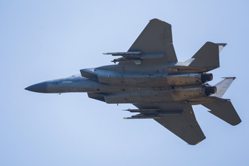 Fototapeta na wymiar An F-15C Eagle from the 48th Fighter Wing overflies the runway at RAF Lakenheath after a training sortie.