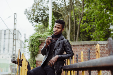 Young black man standing at street