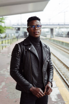 Black man standing on platform