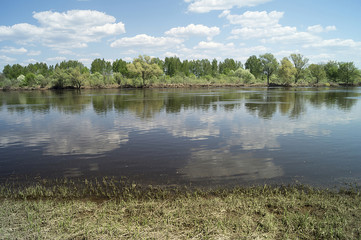 Spring landscape with river in rural terrain