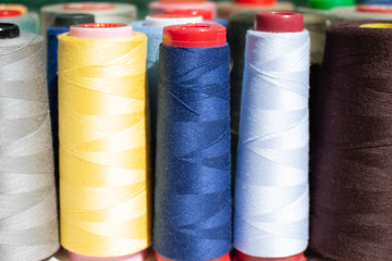 A set of colorful threads for sewing. Close up