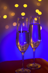 Champagne glass in disco party bar