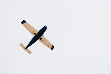 Small retro airplane in the sky