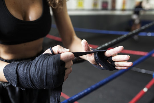 Fitness Woman In Sport Clothes Coiling Boxing Bandage