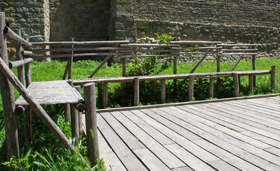 Wooden bench near the ancient castle