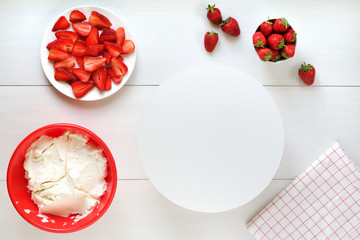Making cake with strawberry and cream background. Top view. Cooking ingredients. Mockup for menu, recipe or culinary classes.