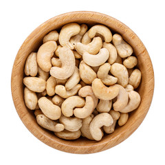 Raw cashew nuts in wooden bowl isolated on white. Top view.