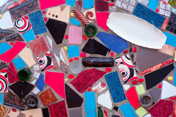 Mosaic on the wall of broken dishes