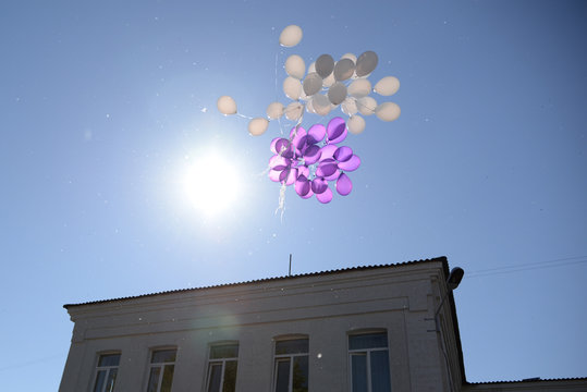 White and purple balls flying to the sky