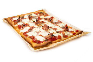 Homemade pizza with ham, mozzarella, tomato sauce, capers and oregano 