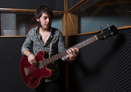 Man playing guitar in studio