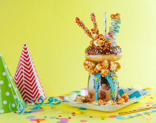 Freak shake on the party table with blank space for text