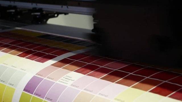 The print plotter prints the spectrum of colors on a large area.