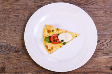 Pizza Caprese with basil