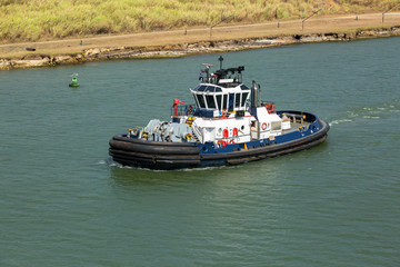 Tug proceeding through the Panama Canal.