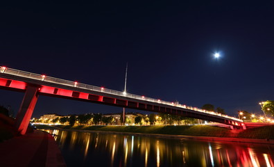 Illuminated bridge at night in Vilnius, Lithuania