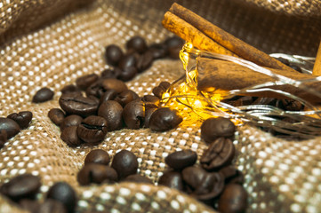 Fresh black coffe beans on cork table