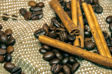 Fresh black coffe beans on cork table