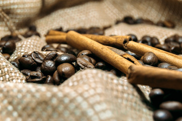 Fresh black coffe beans on cork table