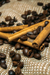 Fresh black coffe beans on cork table