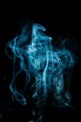 Abstract blue smoke isolated on black background