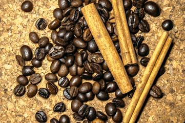 Fresh black coffe beans on cork table