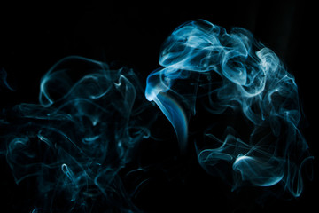 Abstract blue smoke isolated on black background