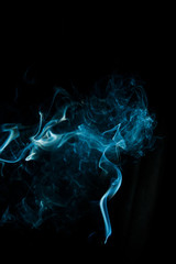 Abstract blue smoke isolated on black background