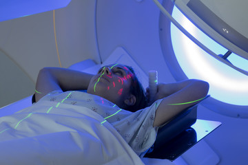 Woman Receiving Radiation Therapy/ Radiotherapy Treatments for Cancer 