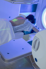Woman Receiving Radiation Therapy/ Radiotherapy Treatments for Cancer 