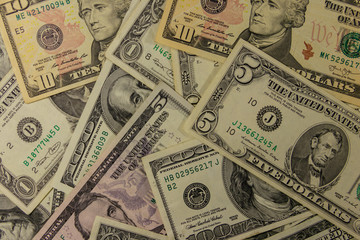 Background of different dollar banknotes