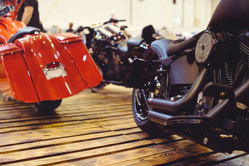 Cropped image of a new motorcycle in the store. Motorcycles and accessories in a modern motorcycle...