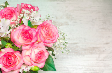 a bouquet of beautiful wedding flowers on a white wooden background. place for text