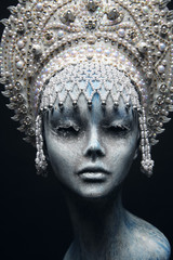 Head of mannequin in creative white metal kokoshnick with pearls