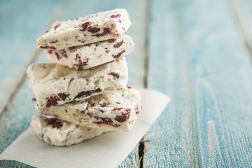Hard nougat on wooden background