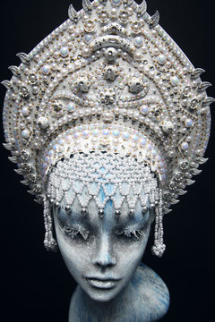 Head of mannequin in creative white metal kokoshnick with pearls