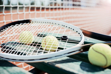Tennis ball with racket on the tennis court. Sport, recreation concept