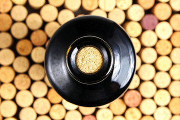 corked glass bottle of red wine, top view