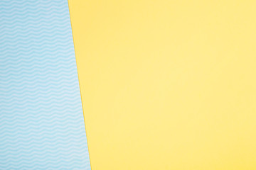 minimal summer yellow blue background symbolizing the sea with waves and sand.