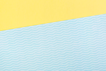 minimal summer yellow blue background symbolizing the sea with waves and sand.