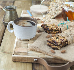 Homemade oatmeal raisin cookies with coffee on wooden background. Copy space