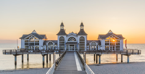 Historical Sellin pier on Ruegen island at sunrise - obrazy, fototapety, plakaty